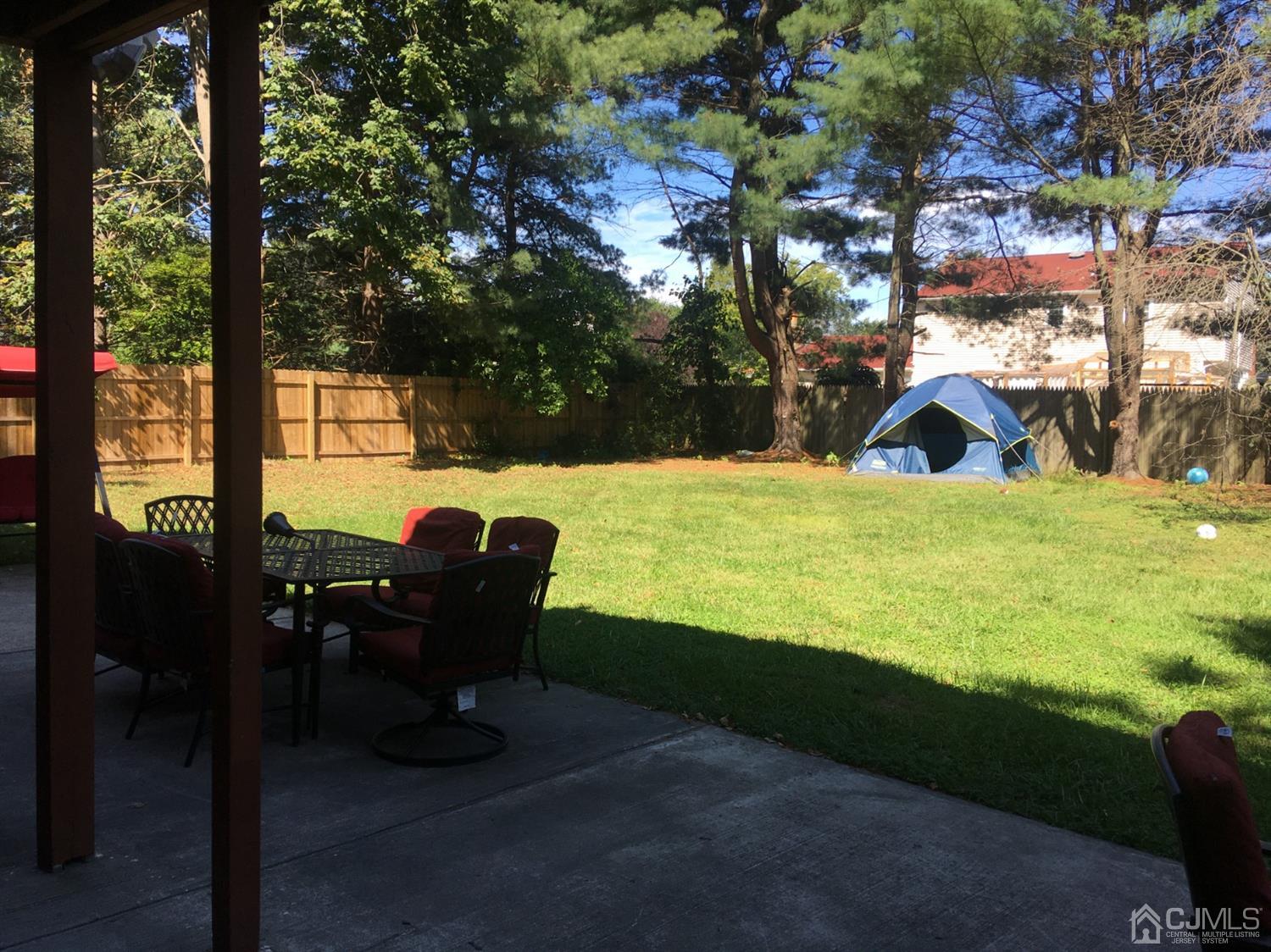 12 Crest Road East Brunswick, NJ 08816 - Photo 27 of 30 a view of a swimming pool with lawn chairs and a fire pit