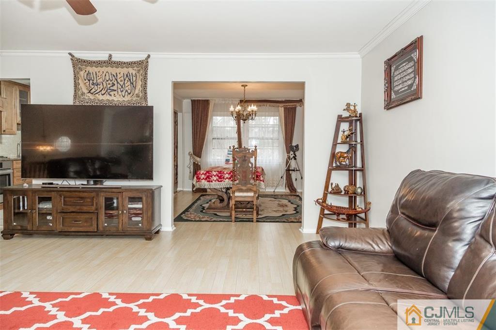 12 Crest Road East Brunswick, NJ 08816 - Photo 10 of 30 a living room with furniture and a flat screen tv