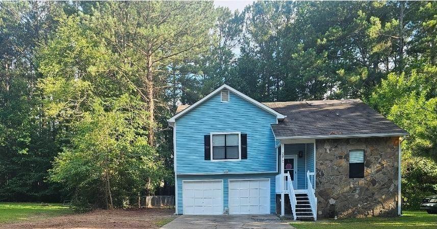 front view of a house with a tree