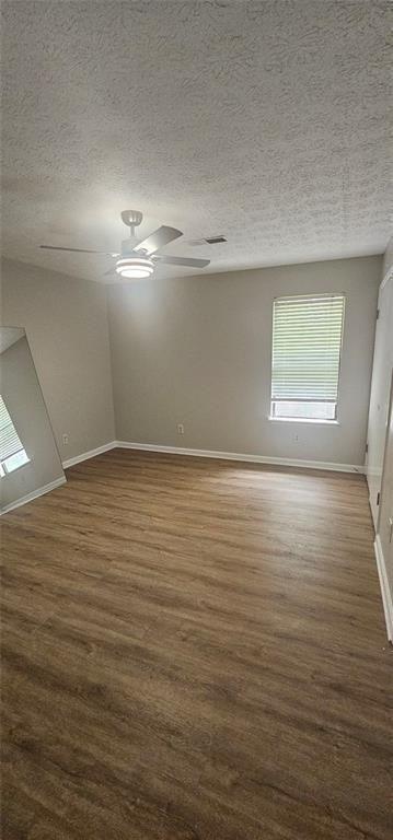 2810 Greenbower Court Atlanta, GA 30349 - Photo 16 of 24 an empty room with wooden floor and windows