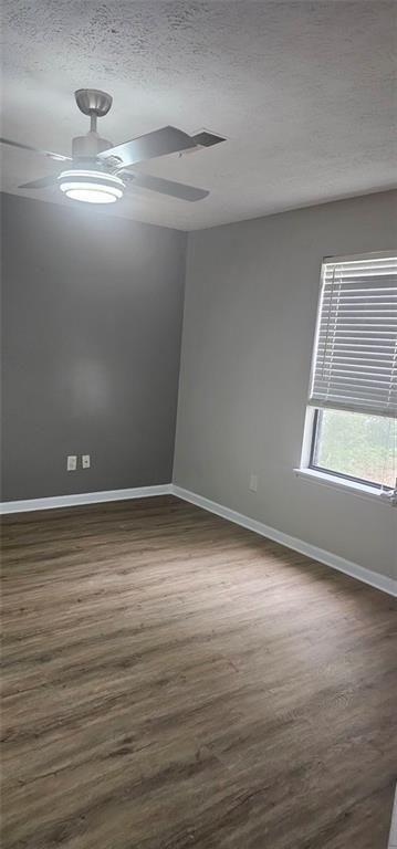 2810 Greenbower Court Atlanta, GA 30349 - Photo 19 of 24 a view of an empty room with wooden floor and a window