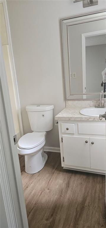 2810 Greenbower Court Atlanta, GA 30349 - Photo 20 of 24 a white toilet sitting next to a bathroom sink
