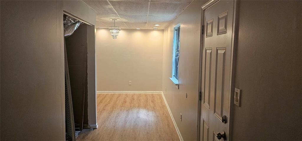 2810 Greenbower Court Atlanta, GA 30349 - Photo 21 of 24 a view of empty room with wooden floor