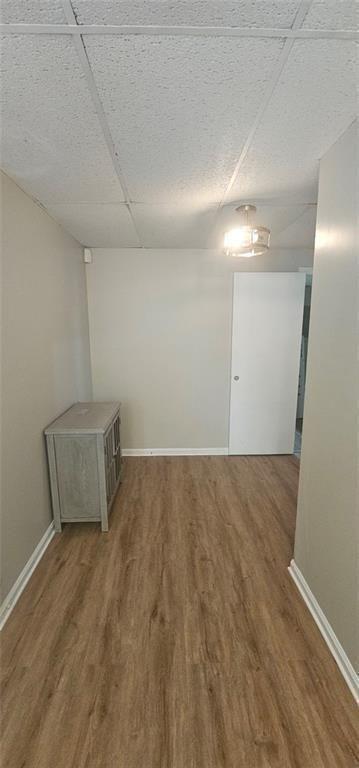2810 Greenbower Court Atlanta, GA 30349 - Photo 23 of 24 an empty room with wooden floor and windows
