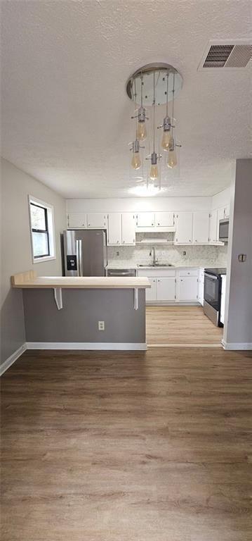 2810 Greenbower Court Atlanta, GA 30349 - Photo 7 of 24 a view of kitchen and kitchen with microwave