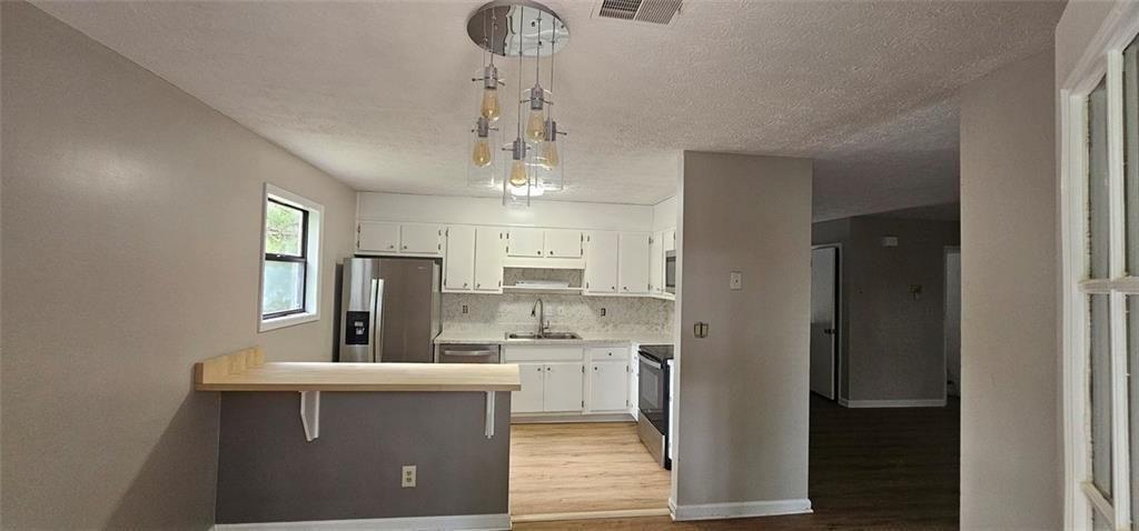 2810 Greenbower Court Atlanta, GA 30349 - Photo 9 of 24 a view of a kitchen from the hallway