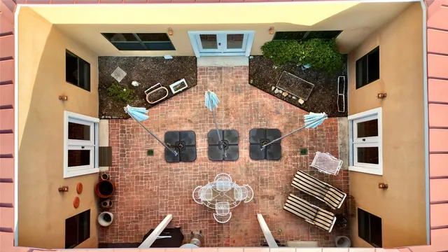 a front view of a house with many windows