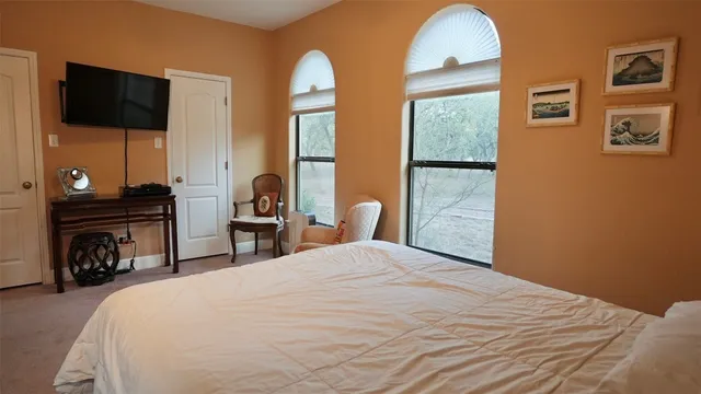 a bathroom with a toilet a sink and a mirror