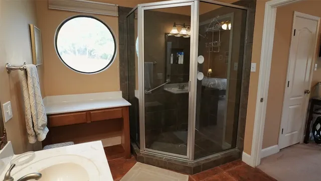 a bathroom with a sink vanity mirror and toilet