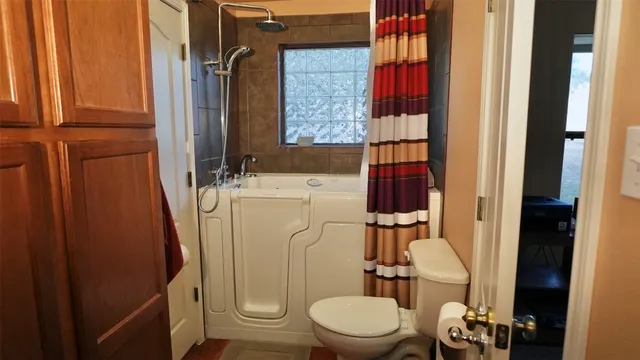 a bathroom with a sink a mirror and a window