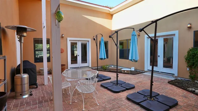 a view of a lake with beach and green space