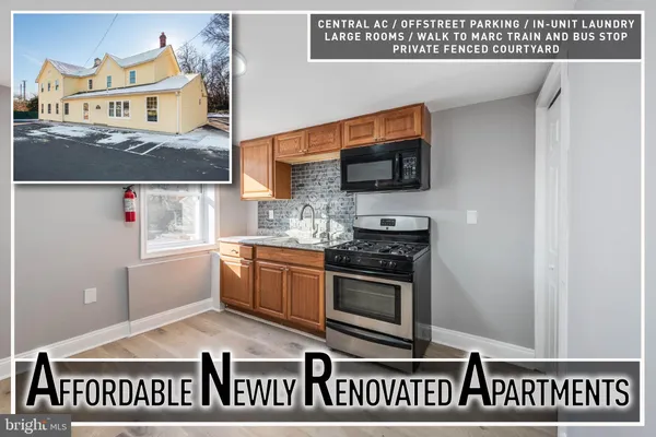a kitchen with a stove and a microwave