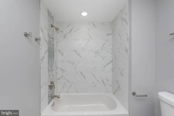 a bathroom with a bathtub