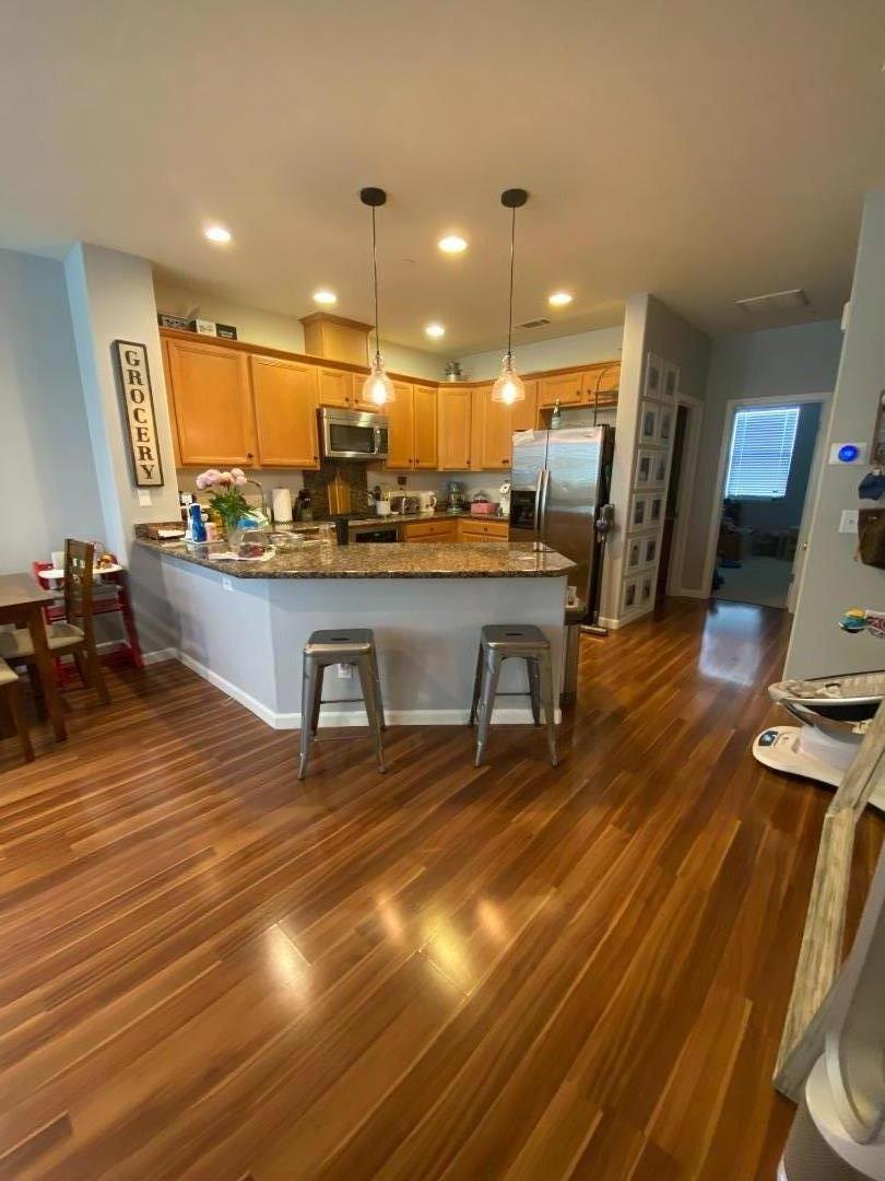 204 Sullivan Way Hayward, CA 94541 - Photo 2 of 8 a view of a living room and kitchen with stainless steel appliances