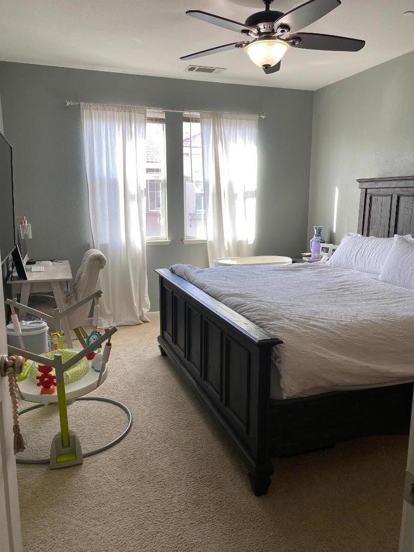 204 Sullivan Way Hayward, CA 94541 - Photo 8 of 8 a bedroom with a bed bed and window