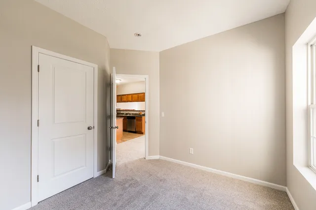 a view of a hallway with two rooms