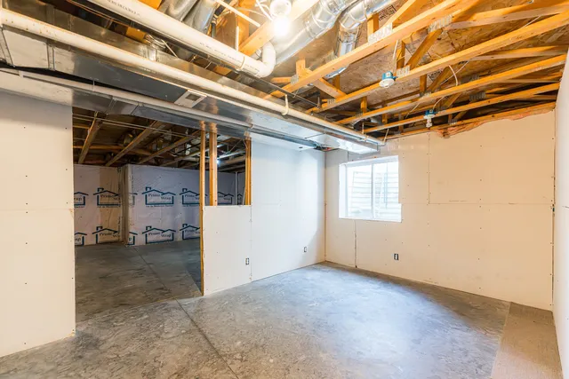 a view of empty room with wooden walls