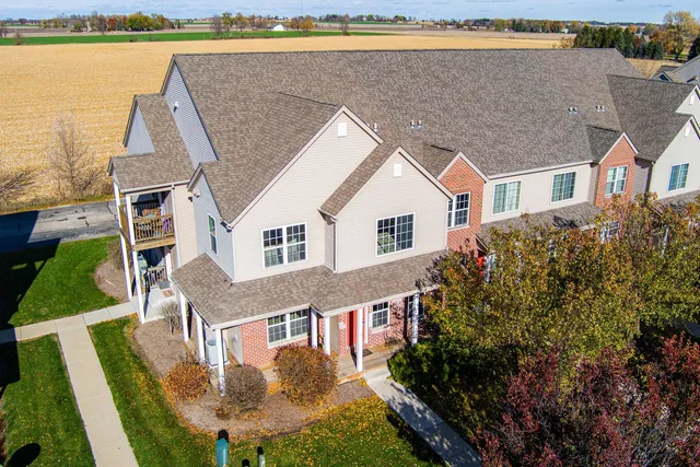 a aerial view of a house with a yard