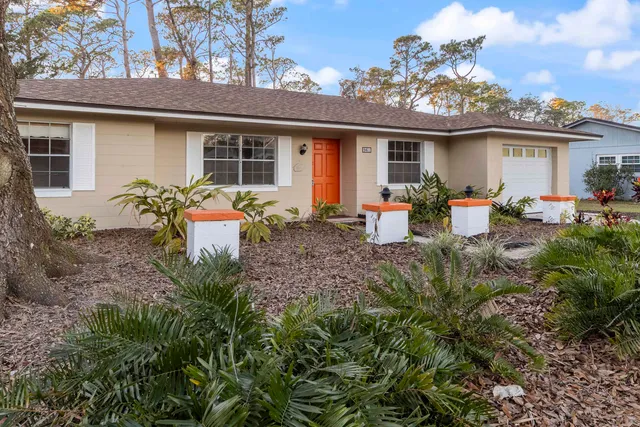 a front view of house with outdoor seating