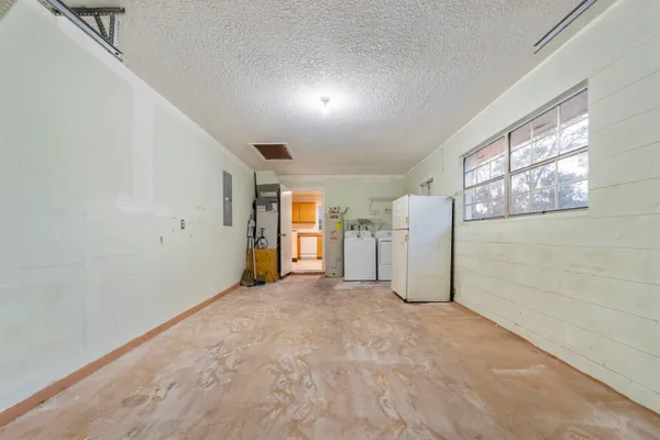 a view of a hallway with an entryway