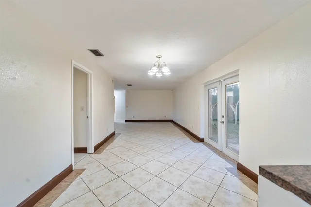 a view of kitchen with center island and stainless steel appliances