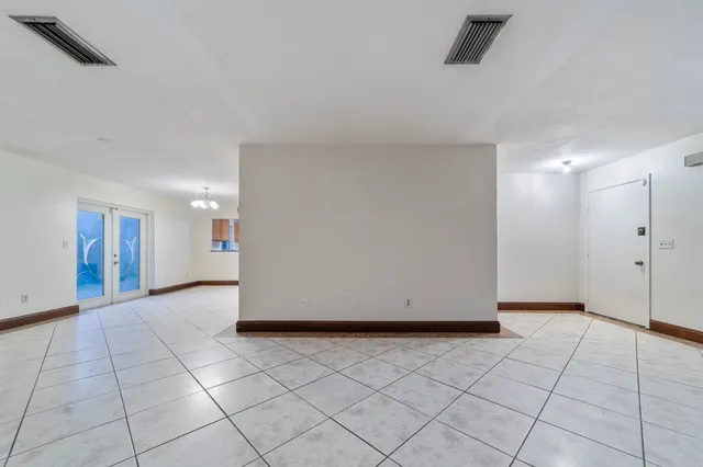 a view of an empty room and window