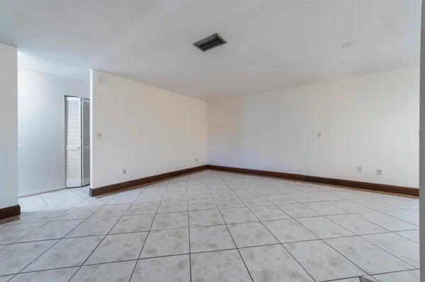 a view of an empty room and window