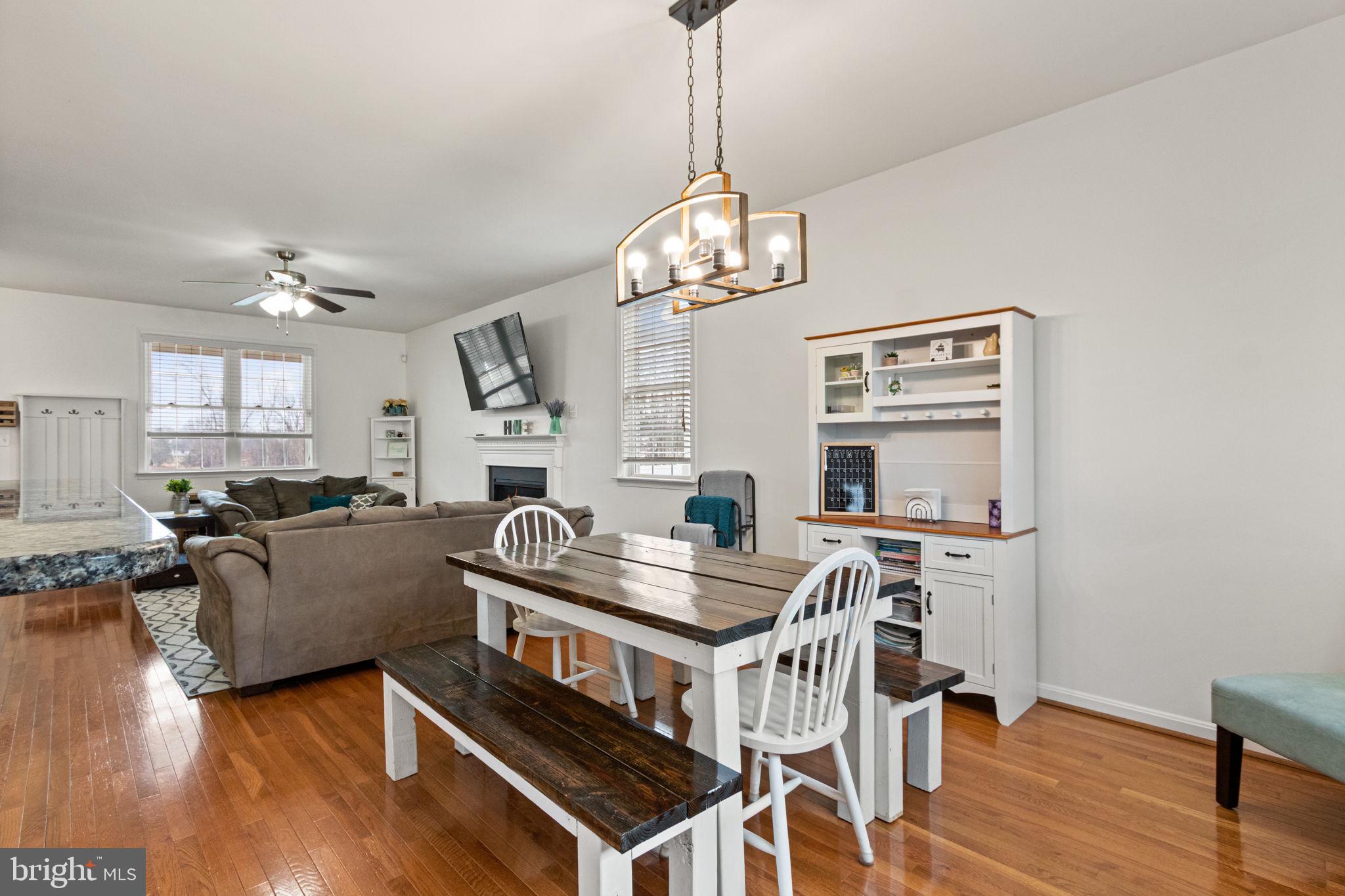 11055 Ransom Lane Bealeton, VA 22712 - Photo 13 of 45 a living room with fireplace furniture and a wooden floor