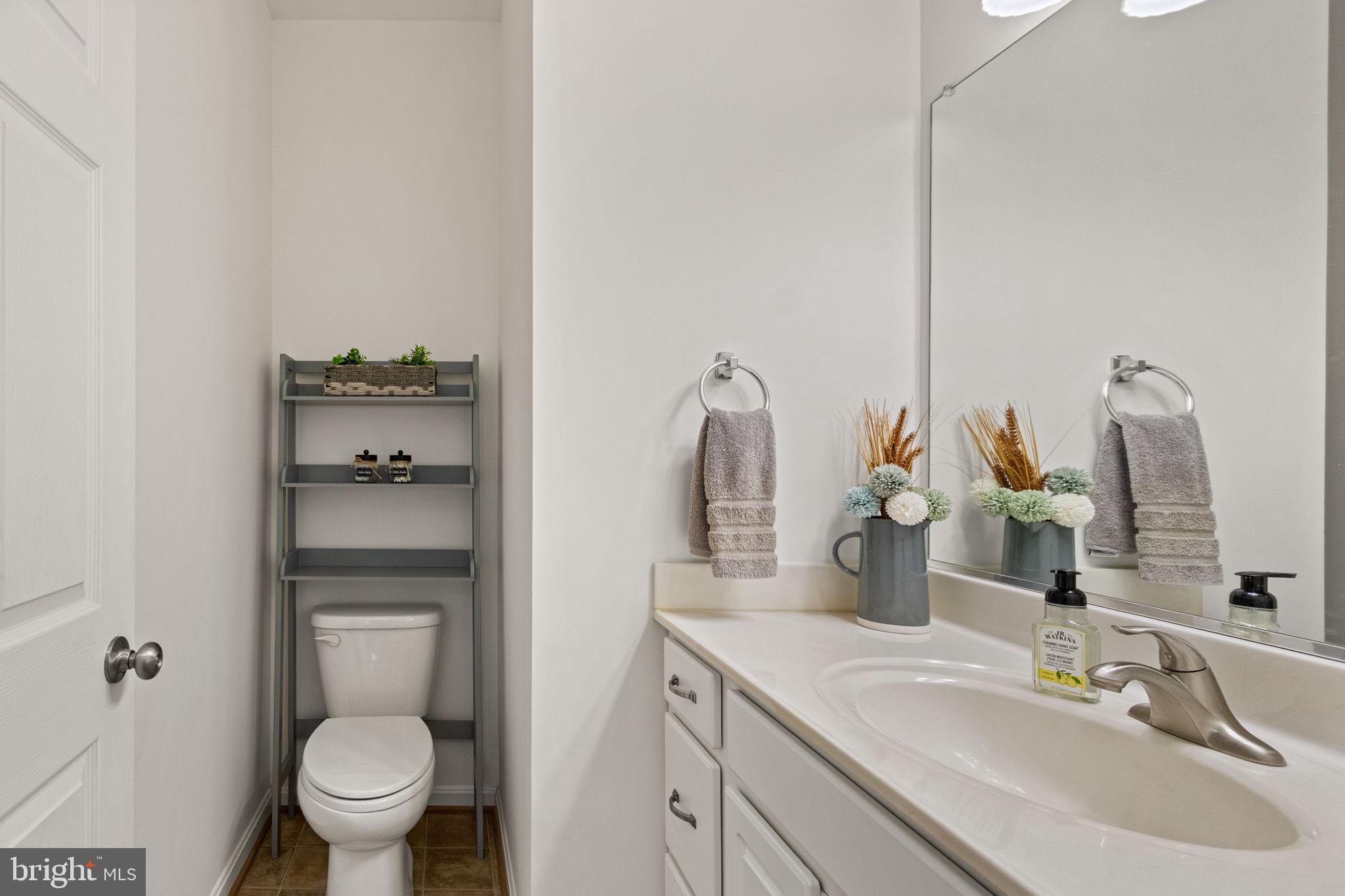 11055 Ransom Lane Bealeton, VA 22712 - Photo 15 of 45 a bathroom with a toilet sink and mirror