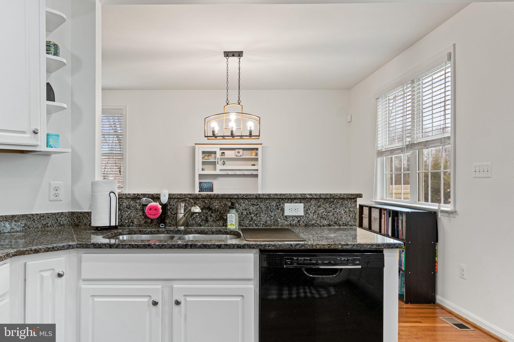 11055 Ransom Lane Bealeton, VA 22712 - Photo 18 of 45 a kitchen with granite countertop a sink and a stove