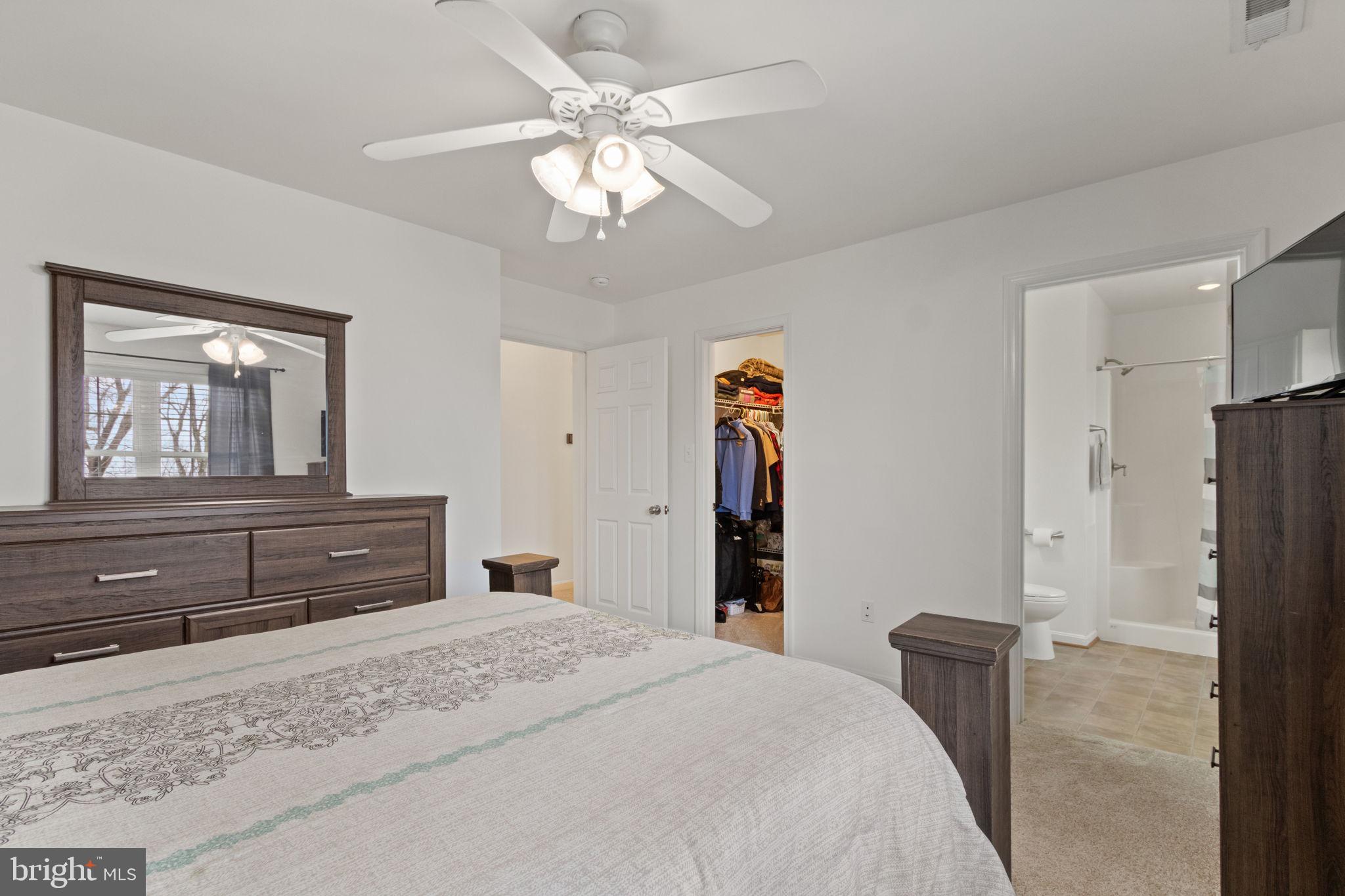 11055 Ransom Lane Bealeton, VA 22712 - Photo 32 of 45 a bedroom with a bed and a dresser