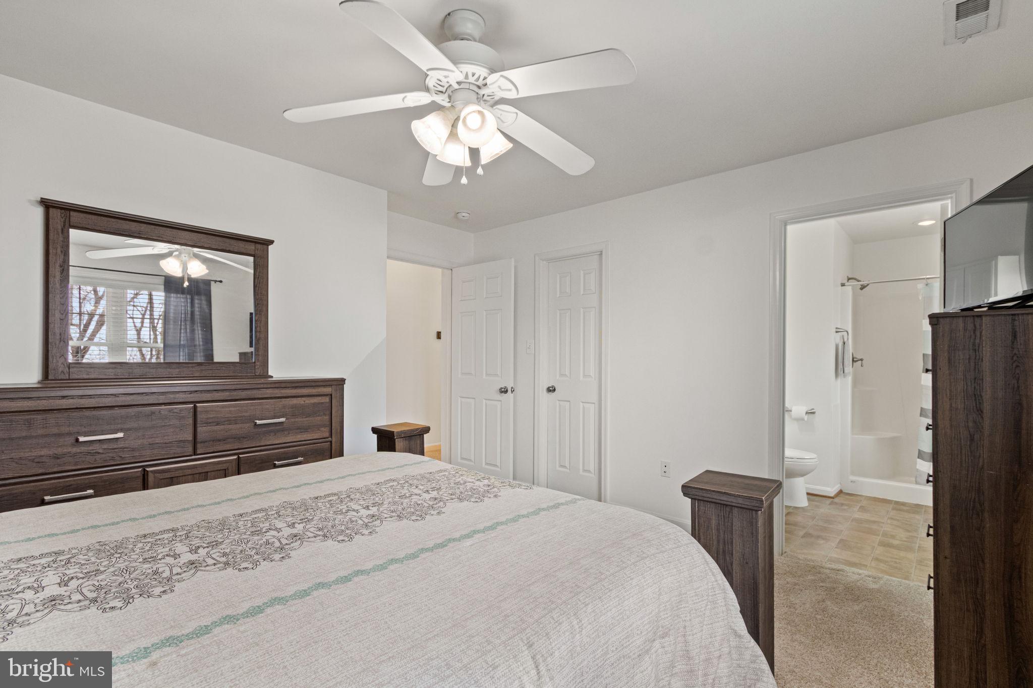 11055 Ransom Lane Bealeton, VA 22712 - Photo 33 of 45 a bedroom with a bed and a dresser