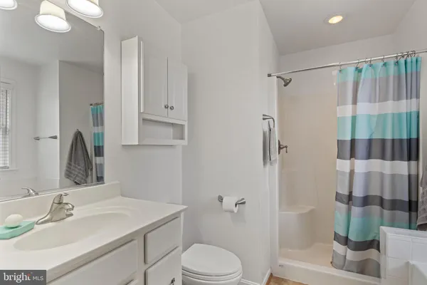 a white bath tub sitting next to a window