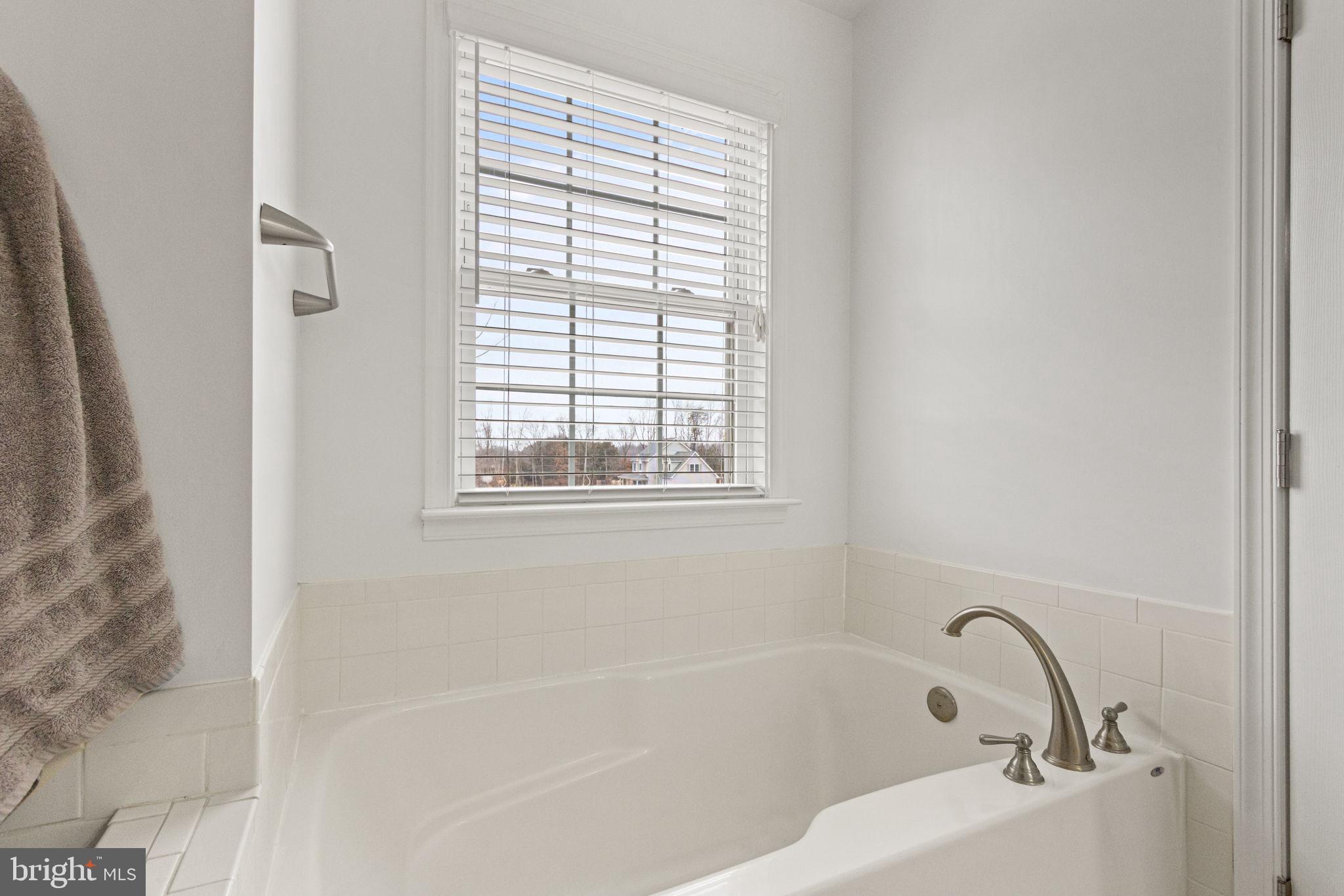 11055 Ransom Lane Bealeton, VA 22712 - Photo 36 of 45 a white bath tub sitting next to a window