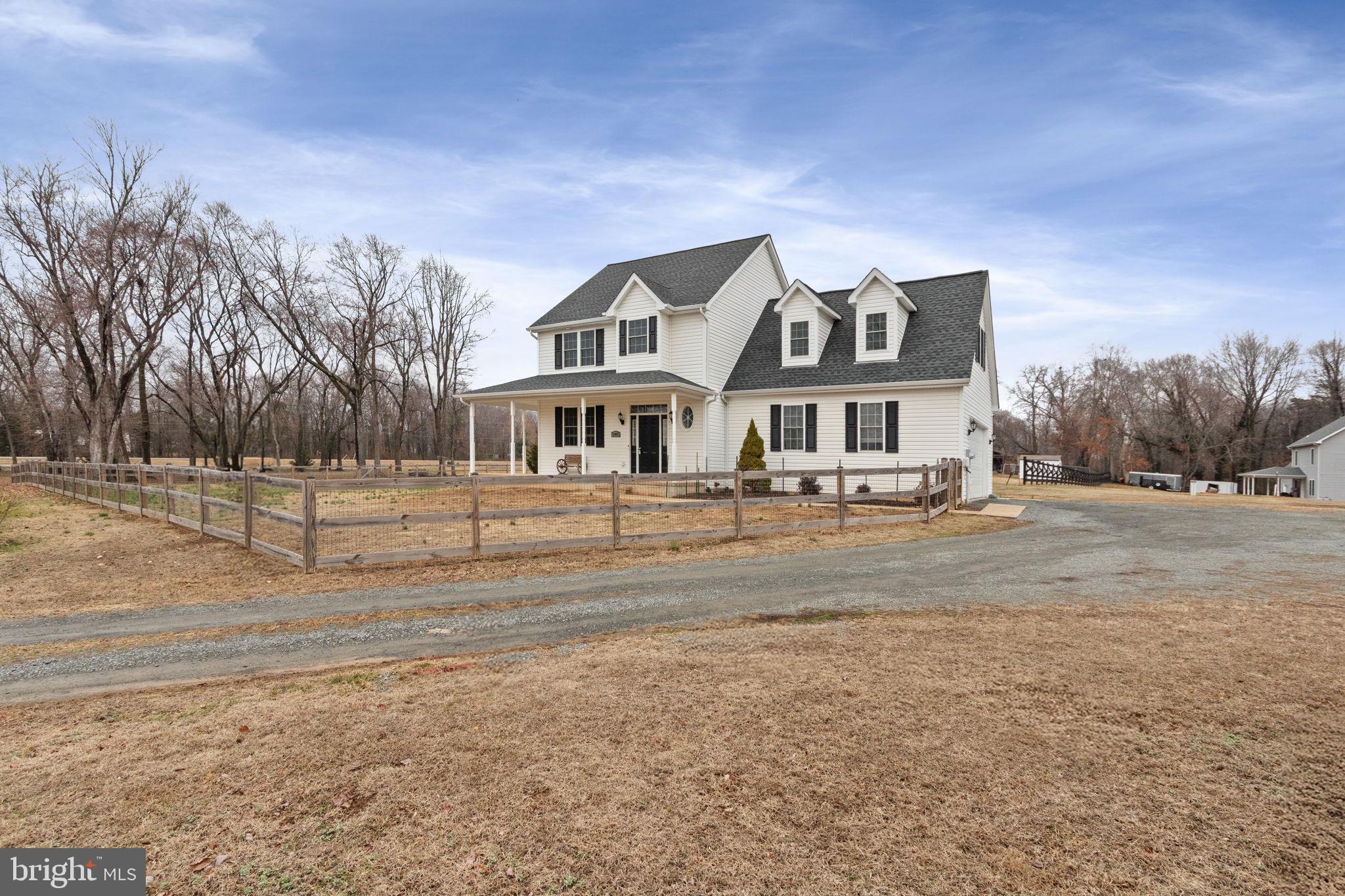 11055 Ransom Lane Bealeton, VA 22712 - Photo 4 of 45 a front view of a house with a yard