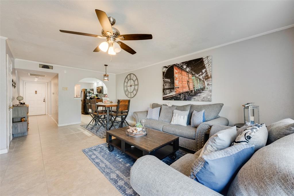 4523 North O'Connor Road, Unit 1176 Irving, TX 75062 - Photo 1 of 17 a living room with furniture and view of kitchen