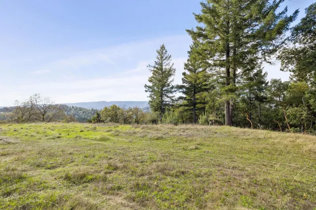 a view of a terrace with two chairs and a table