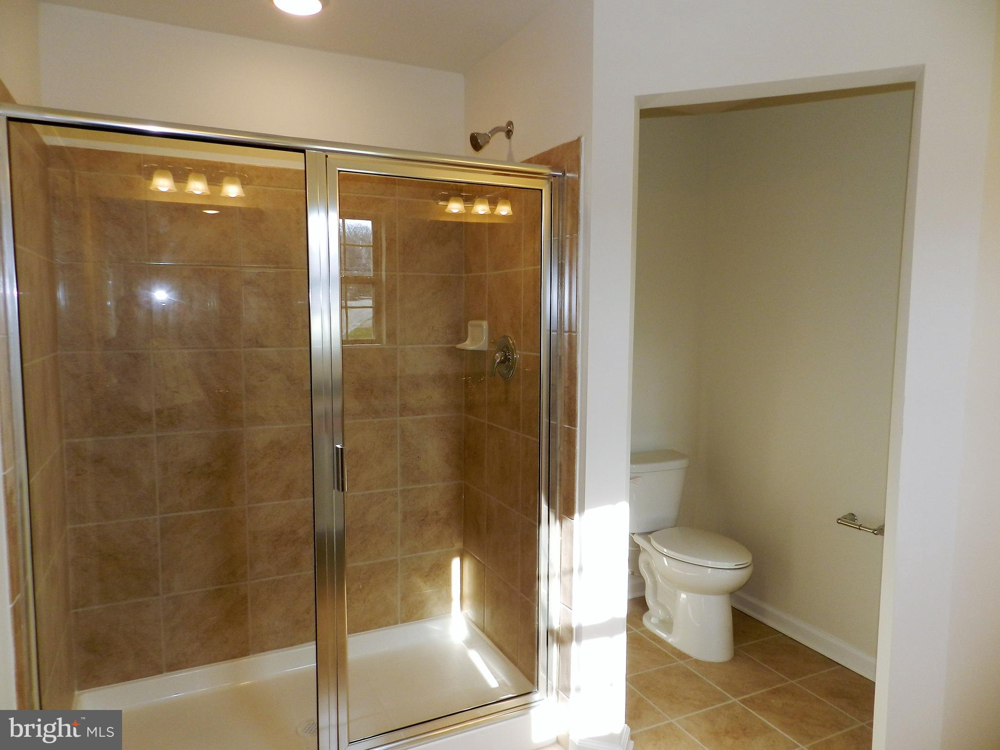 27 Eagle Lane Malvern, PA 19355 - Photo 13 of 24 a bathroom with a shower and a toilet