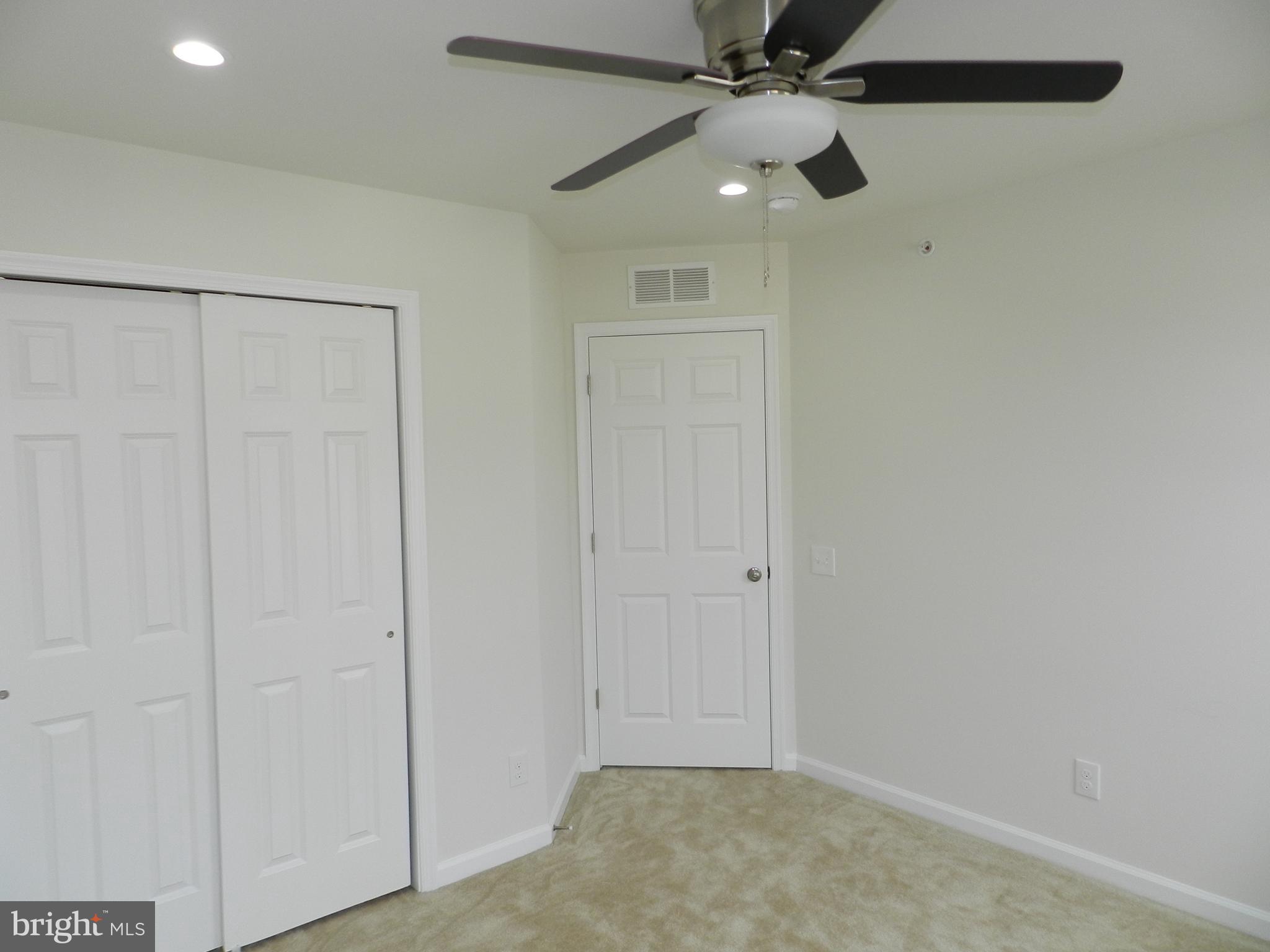 27 Eagle Lane Malvern, PA 19355 - Photo 18 of 24 an empty room with closet and a chandelier fan