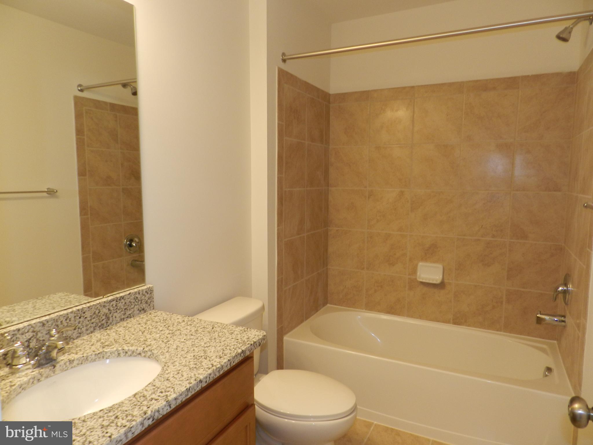 27 Eagle Lane Malvern, PA 19355 - Photo 19 of 24 a bathroom with a granite countertop bathtub shower sink vanity and toilet