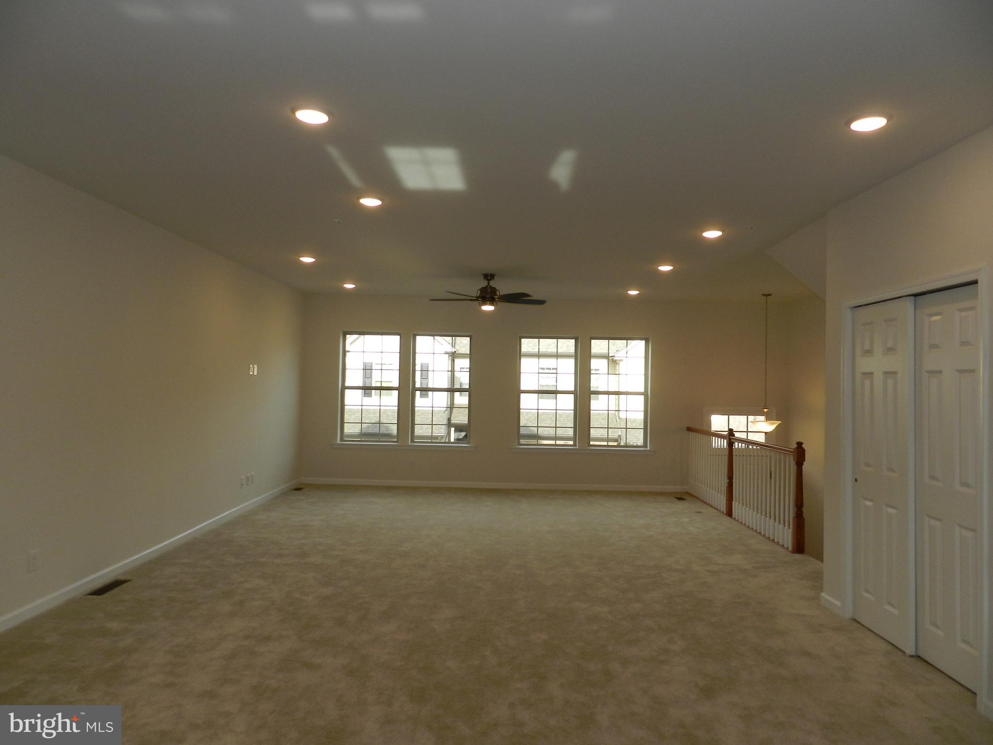 27 Eagle Lane Malvern, PA 19355 - Photo 6 of 24 a view of empty room with windows and chandelier