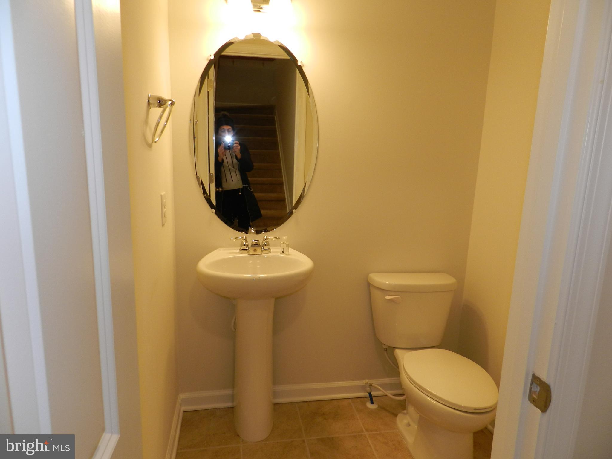 27 Eagle Lane Malvern, PA 19355 - Photo 9 of 24 a bathroom with a toilet and a sink