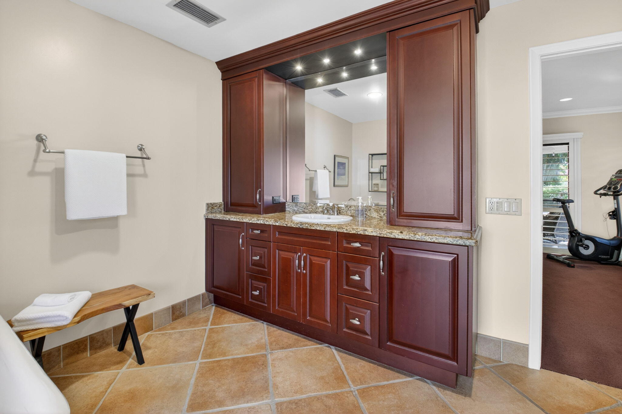 5470 Northwest 3rd Terrace Boca Raton, FL 33487 - Photo 31 of 72 a spacious bathroom with a granite countertop sink and a mirror