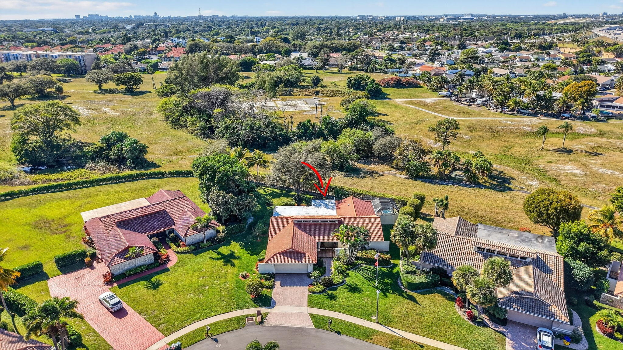 5470 Northwest 3rd Terrace Boca Raton, FL 33487 - Photo 61 of 72 an aerial view of residential houses with outdoor space and river