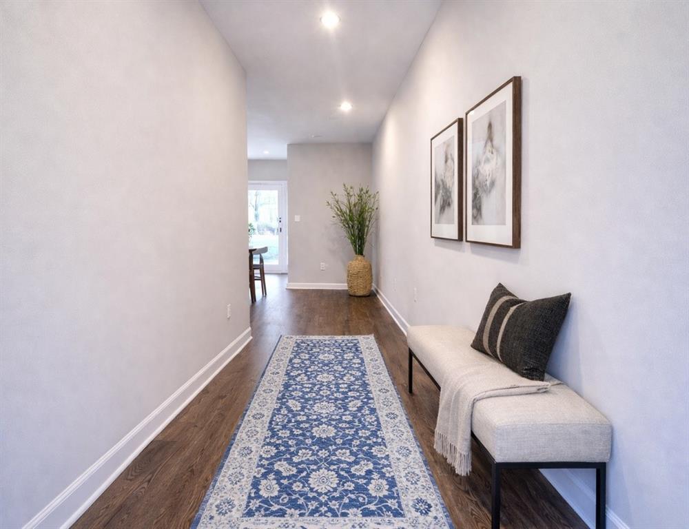 6343 Towhee Way Morrow, GA 30260 - Photo 2 of 36 a hallway with a couch and a potted plant