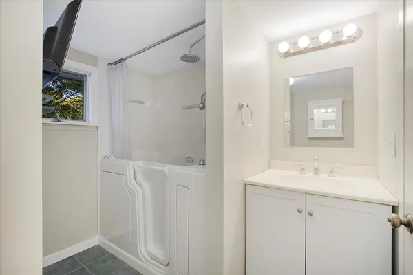 a bathroom with a sink and a mirror