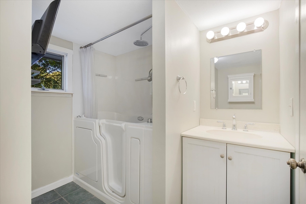 254 Barlows Landing Road Bourne, MA 02559 - Photo 15 of 27 a bathroom with a sink and a mirror