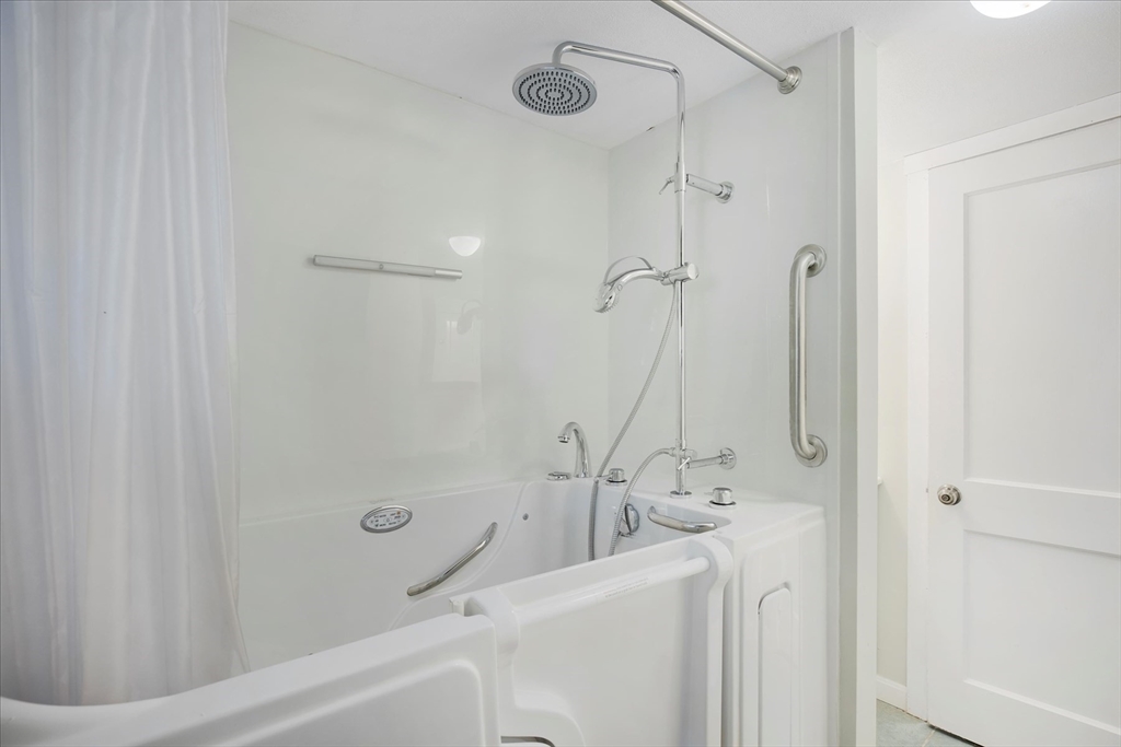 254 Barlows Landing Road Bourne, MA 02559 - Photo 16 of 27 a bathroom with a granite countertop sink a mirror and a shower