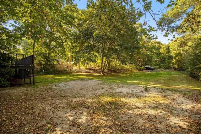 a view of a field with an trees