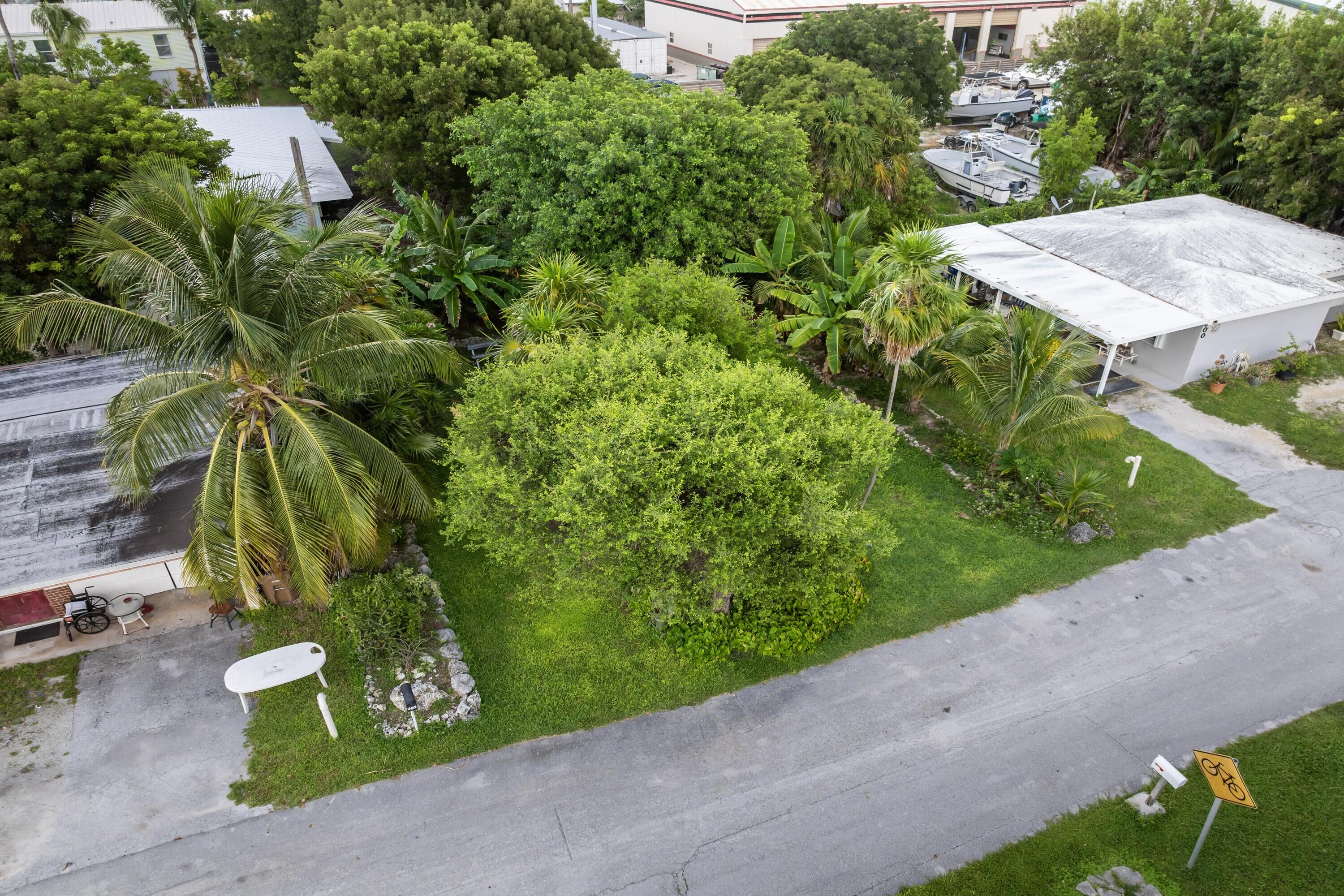 122nd Street Marathon, FL 33050 - Photo 7 of 16 an aerial view of a house with a yard and garden